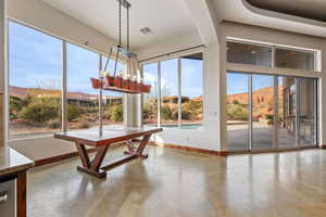 Unfurnished sunroom with a mountain view