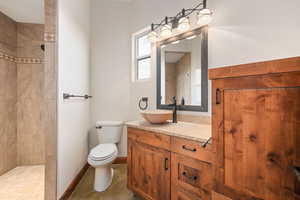 Bathroom featuring vanity and a walk in shower