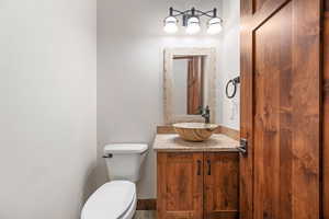 Bathroom featuring vanity and toilet