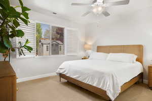 Bedroom with carpet and ceiling fan