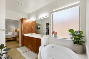 Ensuite bathroom with double vanity and a garden tub