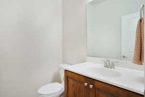 Bathroom with vanity and toilet