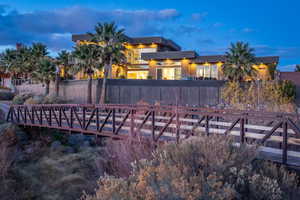 Back of house featuring stucco siding