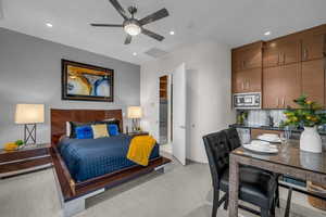 Bedroom with light colored carpet, recessed lighting, and ceiling fan