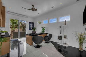 Home office with a ceiling fan, recessed lighting, and light tile patterned floors