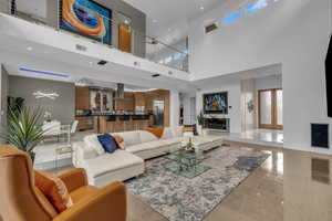 Living room with recessed lighting and a high ceiling