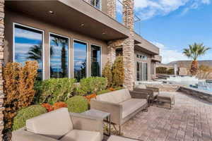 View of patio / terrace with outdoor furniture and an outdoor pool