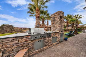 View of patio / terrace with an outdoor kitchen and a sink