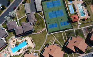 Aerial perspective of suburban area featuring a pool