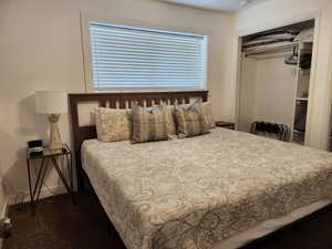 Bedroom featuring a closet and baseboards