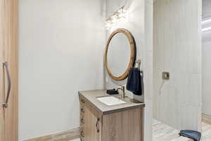 Bathroom with vanity and a walk in shower