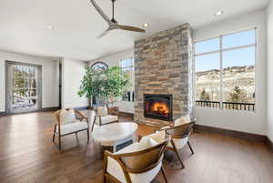 Sitting room featuring a fireplace, recessed lighting, plenty of natural light, a ceiling fan, and wood-type flooring