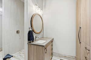 Bathroom with vanity and a walk in shower