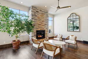 Sitting room with a fireplace, dark wood-style flooring, a ceiling fan, and recessed lighting