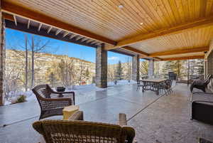 View of patio / terrace with a mountain view and outdoor dining area