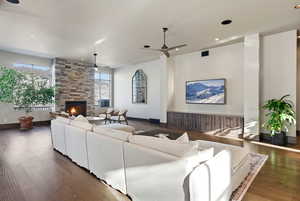 Living area featuring ceiling fan, a fireplace, recessed lighting, and hardwood / wood-style floors