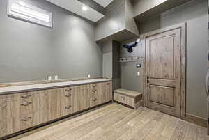 Mudroom featuring light wood finished floors
