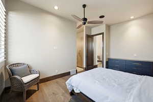 Bedroom featuring light wood-style flooring, recessed lighting, and ceiling fan