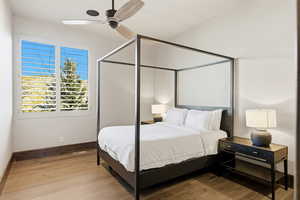 Bedroom featuring ceiling fan and wood finished floors