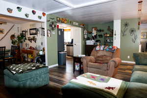 Living room with dark wood-style flooring