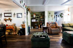 Living area featuring wood finished floors and baseboards