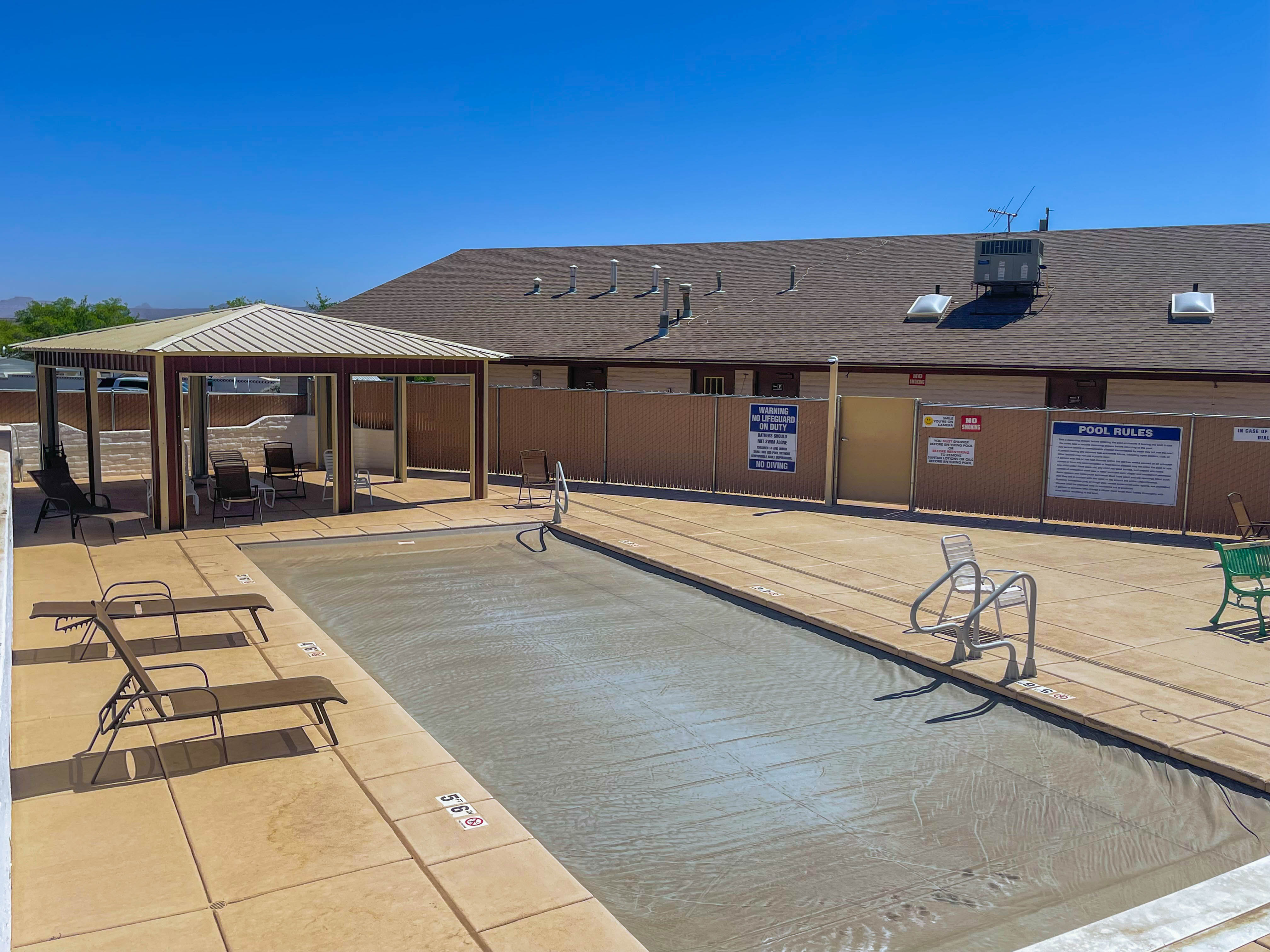 Community pool with a gazebo and a patio area