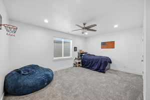 Bedroom featuring carpet, a ceiling fan, and recessed lighting
