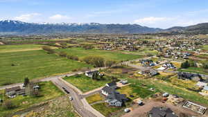 Aerial perspective of suburban area with a mountainous background