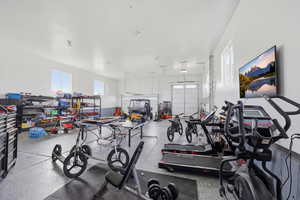 Exercise room featuring a garage