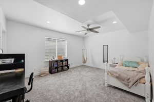Bedroom with light colored carpet, a ceiling fan, and recessed lighting