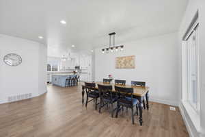 Dining area featuring recessed lighting and light wood-style floors
