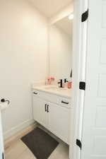 Bathroom with vanity and light wood-style flooring