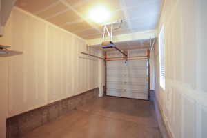 Garage featuring a garage door opener