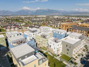 Aerial view of residential area featuring a mountain backdrop