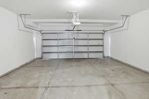 Garage featuring baseboards