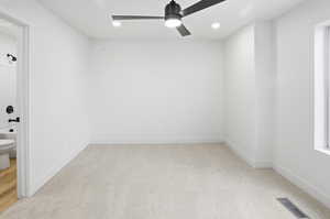Empty room with light carpet, recessed lighting, and a ceiling fan
