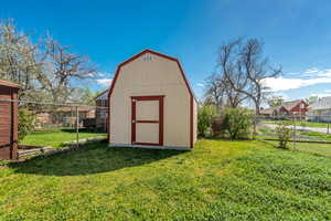 View of shed featuring a fenced backyard