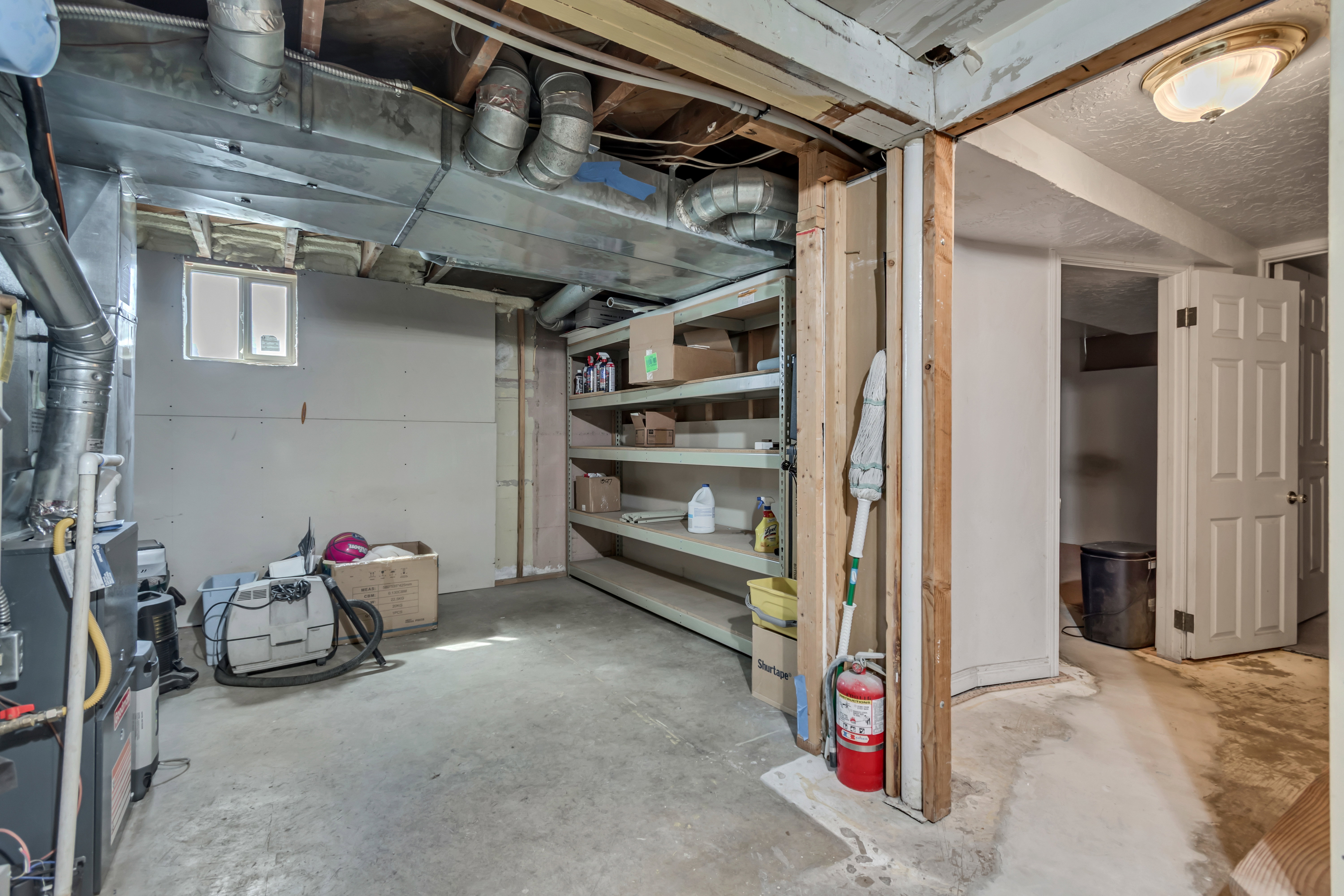 Below grade area featuring heating unit