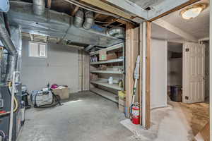 Below grade area featuring heating unit