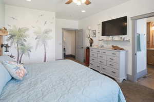 Bedroom featuring a ceiling fan, dark carpet, ensuite bathroom, dark tile patterned floors, and recessed lighting