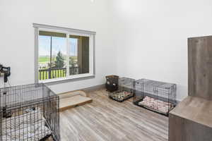 Bedroom featuring light wood-style floors and baseboards