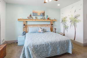 Bedroom with carpet, ceiling fan, and recessed lighting