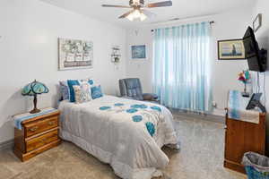 Bedroom with carpet flooring and a ceiling fan