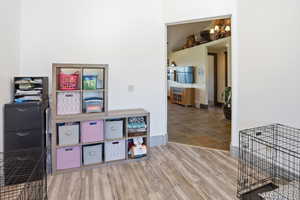 Playroom with light wood-style flooring and baseboards
