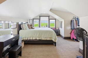 Loft with carpet, lofted ceiling, and recessed lighting