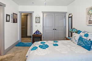 Bedroom featuring a closet and baseboards