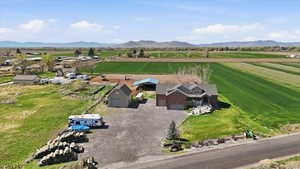 Overview of rural landscape with a mountain backdrop and farmland