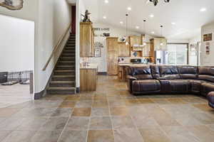 Living area featuring recessed lighting and lofted ceiling