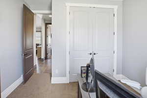 Office featuring baseboards and light colored carpet