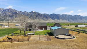View of mountain backdrop with rural landscape